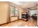 Warm living room featuring a fireplace, hardwood floors and an abundance of natural light at 1526 Peach Ct, Brighton, CO 80601