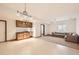 Well-lit, open-concept living area with bar, perfect for entertaining guests in a stylish setting at 1526 Peach Ct, Brighton, CO 80601