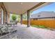 Comfortable brick patio with brick pillars, seating, and serene outdoor space for relaxation at 1526 Peach Ct, Brighton, CO 80601
