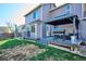 A spacious backyard featuring a deck area with a barbecue, offering a great space for outdoor living at 5027 E Barrington Ave, Castle Rock, CO 80104