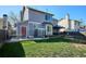 Large backyard with a grassy lawn, a deck, and a fenced area providing ample space for recreation at 5027 E Barrington Ave, Castle Rock, CO 80104