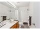 This bright bathroom provides a shower, tub and vanity at 5027 E Barrington Ave, Castle Rock, CO 80104
