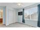 Cozy secondary bedroom with a large window, closet, and soft blue walls at 5027 E Barrington Ave, Castle Rock, CO 80104