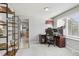 Well-lit home office area with a view into the kitchen, perfect for remote work at 5027 E Barrington Ave, Castle Rock, CO 80104