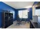 This office offers ample lighting, a desk and room for storage on the shelves at 5027 E Barrington Ave, Castle Rock, CO 80104