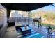 Relaxing outdoor patio with comfortable seating, grill, and string lights for evening enjoyment at 5027 E Barrington Ave, Castle Rock, CO 80104