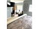 Calm bedroom featuring a sitting area, desk, and soft, neutral tones at 11328 W Radcliffe Dr, Littleton, CO 80127