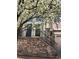 Inviting front entryway with stone accents, a wrought iron railing, and a decorative tree at 11328 W Radcliffe Dr, Littleton, CO 80127