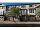 Attractive townhome featuring a two-car garage and stone accents at 11328 W Radcliffe Dr, Littleton, CO 80127