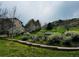 Well maintained greenspace with walking path, flowering trees, and community seating at 11328 W Radcliffe Dr, Littleton, CO 80127