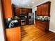 Modern kitchen featuring wood cabinets, stainless steel appliances, and dark countertops at 11328 W Radcliffe Dr, Littleton, CO 80127