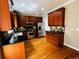 Gourmet kitchen boasts wood floors, stainless appliances, granite counters, and beautiful cabinetry at 11328 W Radcliffe Dr, Littleton, CO 80127