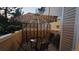 Comfortable patio area with table, chairs, privacy screen and ambient umbrella lighting at 11328 W Radcliffe Dr, Littleton, CO 80127