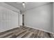 This bedroom features new wood flooring, a ceiling fan, and a closet at 8330 Zuni St # 219, Denver, CO 80221