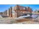 A view of the condo complex with its brick and wood facade at 8330 Zuni St # 219, Denver, CO 80221