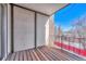 Outdoor patio featuring wooden deck and iron railing and view at 8330 Zuni St # 219, Denver, CO 80221