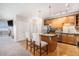 Well-lit kitchen featuring a breakfast bar that opens to the dining and living areas at 9318 Las Ramblas Ct # R, Parker, CO 80134