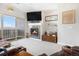 Cozy living room features a modern fireplace and sliding glass doors to the outdoor balcony at 9318 Las Ramblas Ct # R, Parker, CO 80134