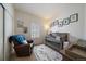 Charming Bedroom with a crib, rocker, and window with plantation shutters at 5437 S Granby Ct, Aurora, CO 80015