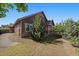 Charming single-Gathering home featuring brown siding, stone accents, a well-maintained lawn, and mature trees at 5437 S Granby Ct, Aurora, CO 80015