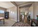 Spacious foyer showcasing hardwood floors and a view into the open-concept living spaces, blending carpeted and wood surfaces at 5437 S Granby Ct, Aurora, CO 80015