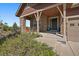 Inviting covered front porch with stone pillars and a cozy seating area, perfect for relaxing and enjoying the neighborhood at 5437 S Granby Ct, Aurora, CO 80015