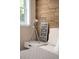 Stylish modern decor displayed on a night stand in bedroom with wood accent wall at 4590 Grove St, Denver, CO 80211