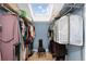 Walk-in closet with skylight, built-in shelving, and organized clothing storage at 4590 Grove St, Denver, CO 80211