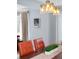 Dining room showcasing modern pendant lighting above a wood table with leather chairs at 4590 Grove St, Denver, CO 80211
