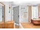 Bright entryway featuring wood floors, coat racks, and classic architectural details at 4590 Grove St, Denver, CO 80211
