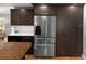 Modern kitchen featuring stainless steel refrigerator and plenty of cabinet storage at 4590 Grove St, Denver, CO 80211