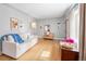 Bright living room featuring hardwood floors, comfortable seating, and stylish accents at 4590 Grove St, Denver, CO 80211