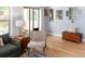 Living room features access to patio, hardwood floors, and modern decor at 4590 Grove St, Denver, CO 80211