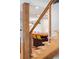 Close-up of a modern staircase with wooden steps and a cable railing system at 4590 Grove St, Denver, CO 80211