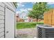 A shed on the left looks out over a grassy yard between townhomes with an AC unit on the right at 6722 S Independence St, Littleton, CO 80128