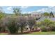 Lush backyard featuring mature landscaping, a black metal fence, and a glimpse of the house at 6722 S Independence St, Littleton, CO 80128
