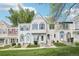 Charming townhome with manicured lawn, decorative trim, and inviting front entrance at 6722 S Independence St, Littleton, CO 80128