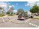 Designated parking area with visible unit numbers and surrounding landscaping at 6722 S Independence St, Littleton, CO 80128