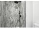 Elegant shower with gray brick pattern tile and matte black fixtures at 6722 S Independence St, Littleton, CO 80128