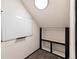 Small attic space with carpet and built-in shelving at 9626 E 105Th Pl, Commerce City, CO 80640
