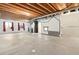 Unfinished basement with exposed ceiling, concrete floor and whimsical painted decorations at 9626 E 105Th Pl, Commerce City, CO 80640