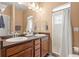 Lovely bathroom featuring double sinks, sleek countertops, a tile floor, and a tiled shower at 9626 E 105Th Pl, Commerce City, CO 80640
