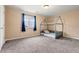 Carpeted bedroom with house-shaped bed frame and natural light at 9626 E 105Th Pl, Commerce City, CO 80640