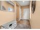 Inviting entryway features attractive tile, a useful shoe bench, a coat closet, and neutral paint at 9626 E 105Th Pl, Commerce City, CO 80640
