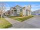 Attractive two story home featuring an expansive lawn, a corner lot and serene neighborhood surroundings at 9626 E 105Th Pl, Commerce City, CO 80640