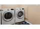 Laundry room with front loading LG washer and dryer at 9626 E 105Th Pl, Commerce City, CO 80640