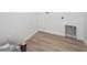 Simple laundry room with laminate floors and white walls and connections for a washer and dryer at 24780 E 39Th Ave, Aurora, CO 80019