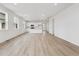 Bright and airy living room showcasing an open floor plan and stylish kitchen with modern appliances at 24780 E 39Th Ave, Aurora, CO 80019