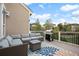 Relaxing back deck with comfortable outdoor furniture and a grill at 7284 Timbercrest Ln, Castle Pines, CO 80108