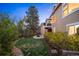 Spacious backyard with a patio, a fire pit, and mature trees at 7284 Timbercrest Ln, Castle Pines, CO 80108